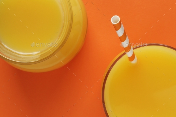 Orange background with orange juice and bottle Stock Photo by MPPLLC45