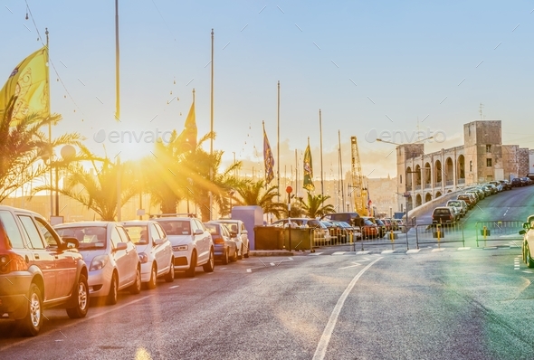 Scenic view of evening road street of Kalkara city in Malta in rays of sunset. Summer travel vibes