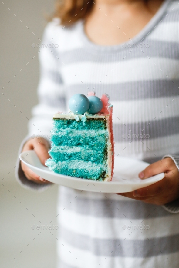 It\'s a boy, Child with a piece of cake for gender reveal party