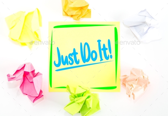 A positive message on a colourful sticky note telling people to Just Do It for motivation paper,