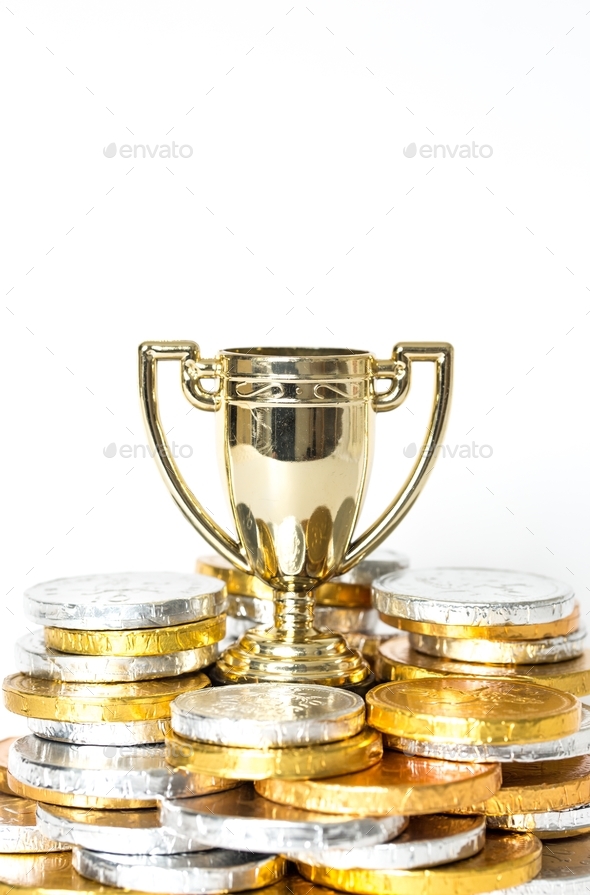 A gold trophy surrounded by prize-money for the winner of Victor of a competition