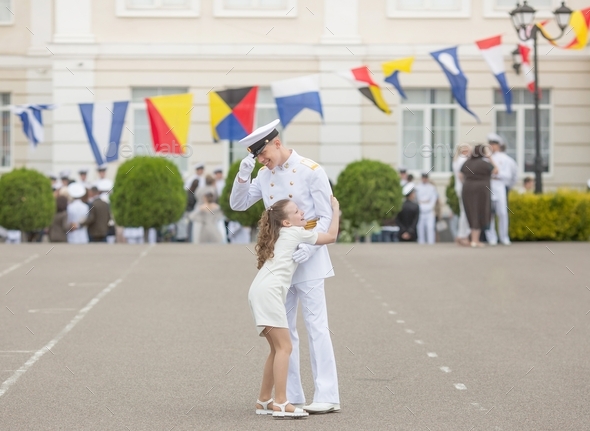 joyful meeting of a boy student of a military naval school with his sister  - Stock Photo - Images