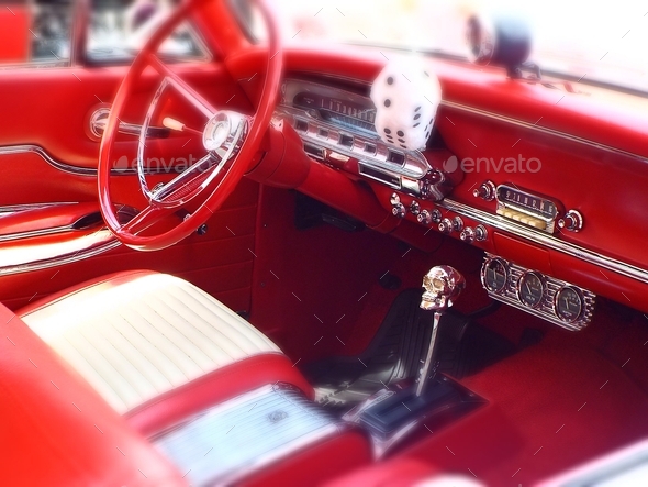 Interior of a red hot rod with skull gear shifter