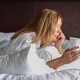 Woman laying on bed in morning with coffee  - PhotoDune Item for Sale