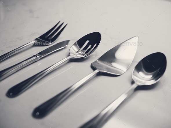 Serving set silver cutlery on countertop marble minimal fork slicer pie cake salad spoon knife