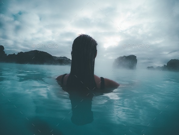 Woman soaking swimming sitting in hot steam sauna pool spa vacation ...