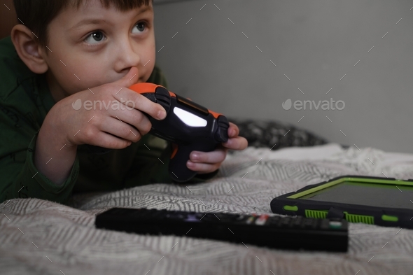 Kids playing video games at home on console