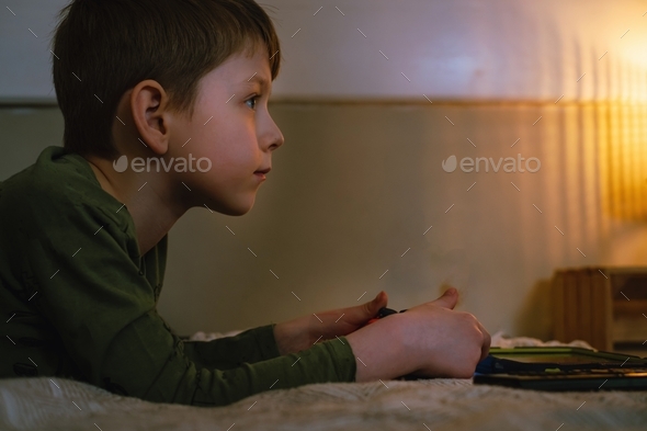 Kids playing video games at home on console