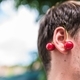 Young man holding cherry earings  - PhotoDune Item for Sale