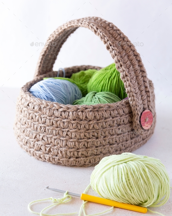 jute basket with colorful threads for knitting