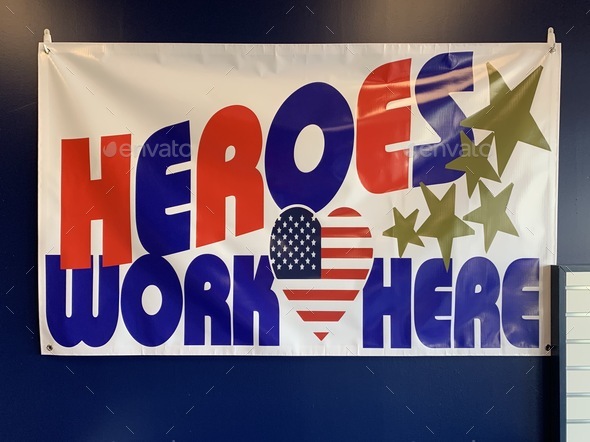 Big banner at the post office that reads “Heroes work here” during Covid19 pandemic.