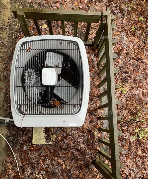 AC Air Conditioner home outdoor unit overhead during Fall time with some morning frost