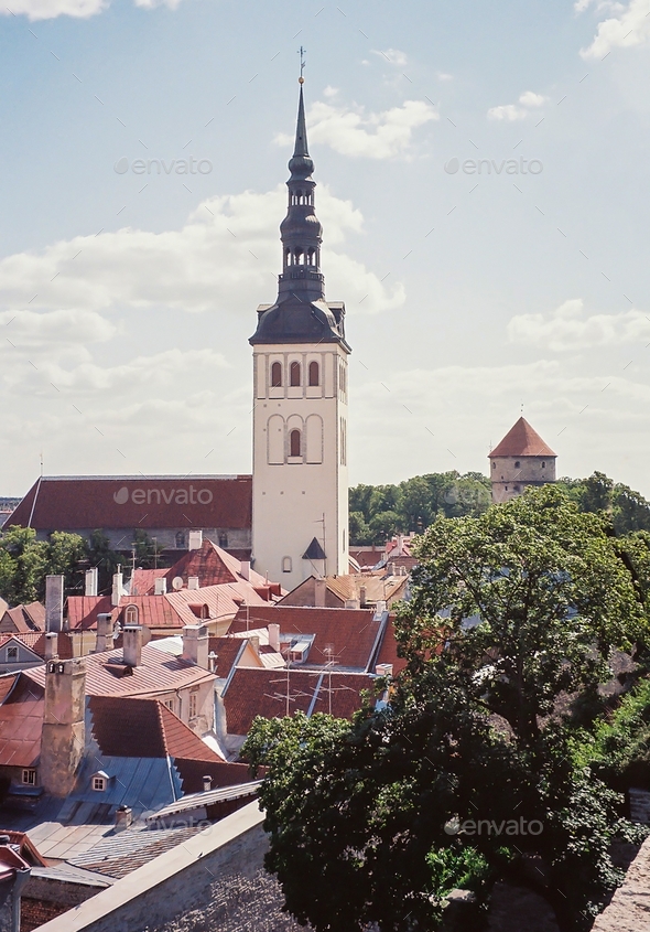 Tallinn. Estonia. Old town homes rooftops view & the St Nicholas Church fishermen & sailors patron.