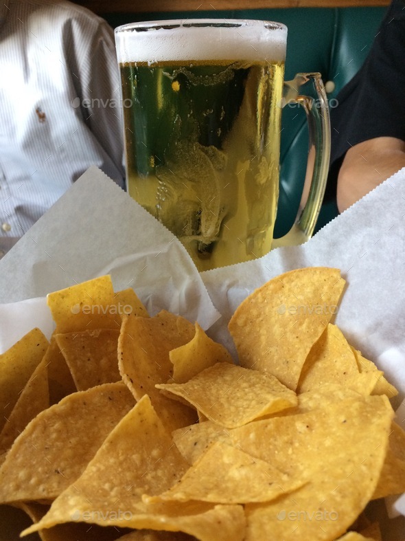 Happy hour time with beer & tortilla chips at the Mexican restaurant