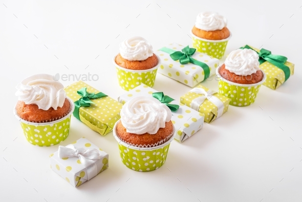 Festive banner with cupcakes and gift boxes white background.