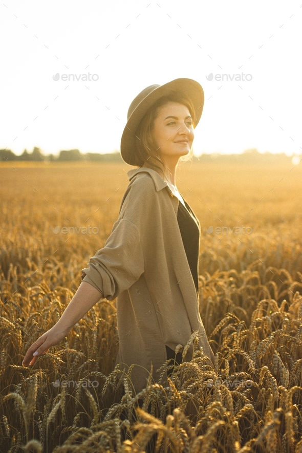 Photo shoot of a girl in the field. Natural beauty. Rest and relaxation. Open area. Sunset.