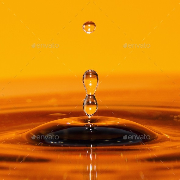 Close up of a water drop on a orange background