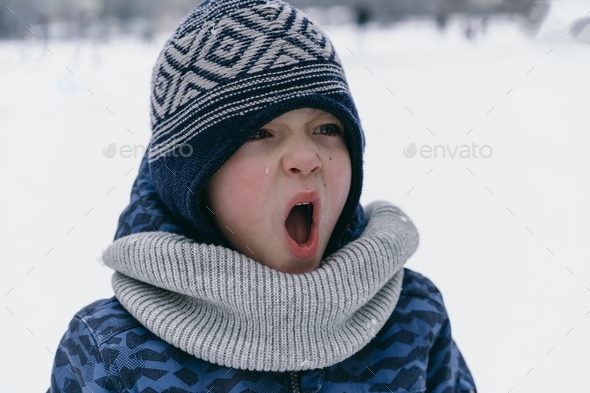 Portrait of a Boy in winter clothes screams and cries. Emotions Stock ...