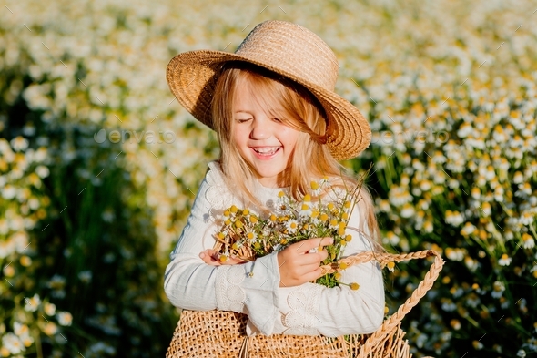 happy little girl in a field of daisies in summer Stock Photo by ...