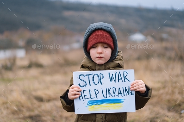 War of Russia against Ukraine. Crying boy asks to stop the war in Ukraine.