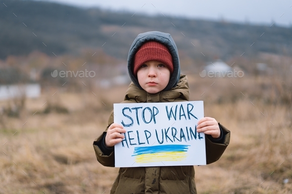 War of Russia against Ukraine. Crying boy asks to stop the war in Ukraine.