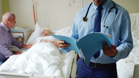 Doctor checking report alt