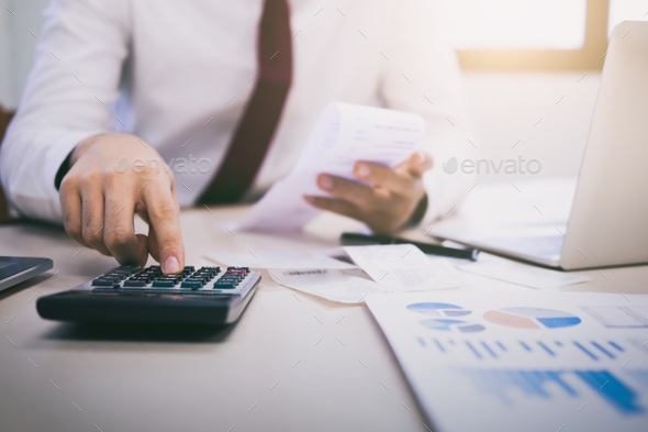 Financial Officers Calculate Expenses From Cash Bills