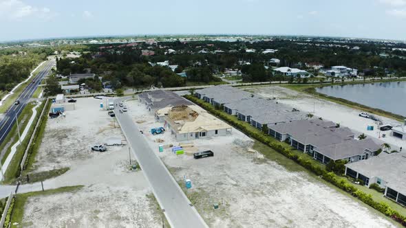 Aerial Drone View of New Residential with Wooden Truss Post and Beam Stick Built Construction alt