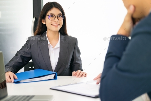 Confident businessman in a job interview with a corporate personnel manager.