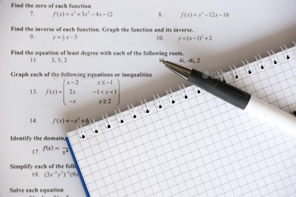 Handwriting of mathematics quadratic equation on examination, practice, quiz or test in maths class