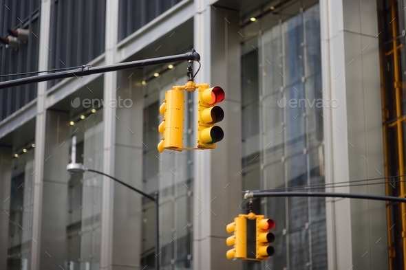 Yellow Traffic Light on background of skyscrapers, Manhattan, New York, USA. Red stop signal. - Stock Photo - Images