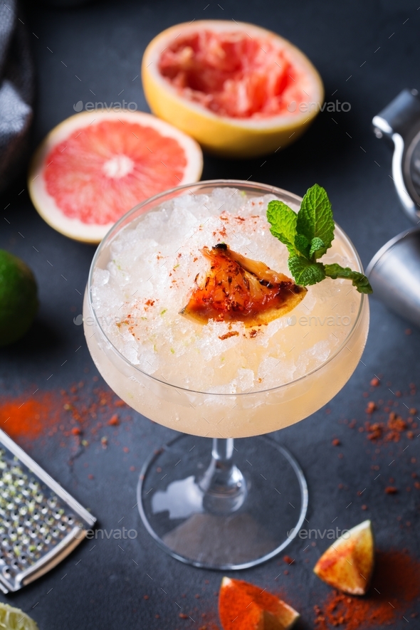 Frozen Mezcal or mescal Paloma cocktail with grilled grapefruit Stock