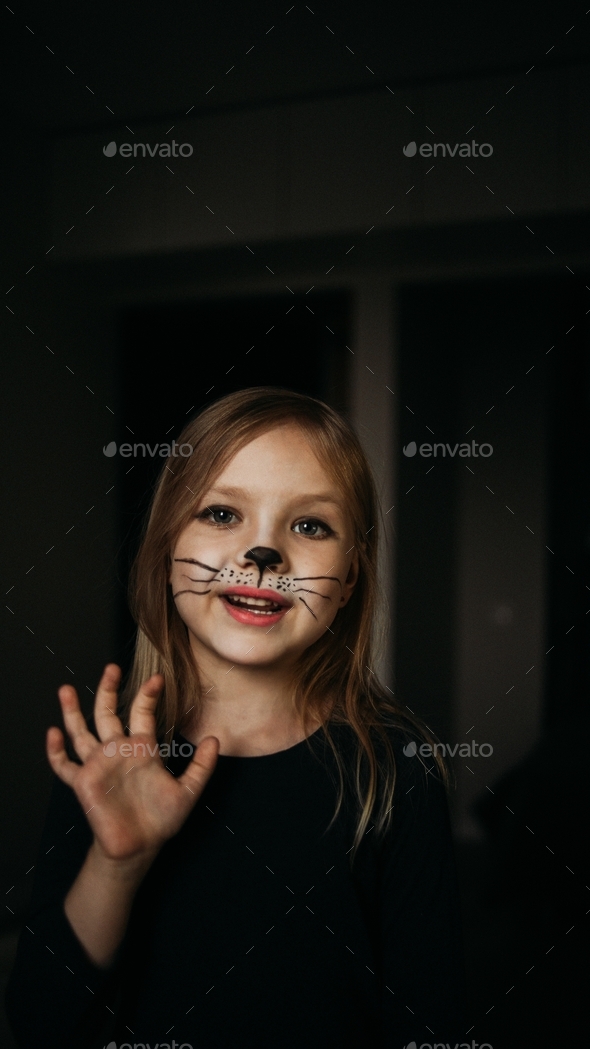 Pretty little girl with cat face painting Stock Photo by denira21