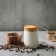 Dalgona frothy coffee trend Korean drink milk latte with coffee foam in glass mug - PhotoDune Item for Sale