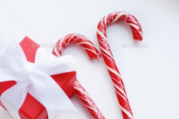 Gift box and candy canes Stock Photo by margaritaylita | PhotoDune