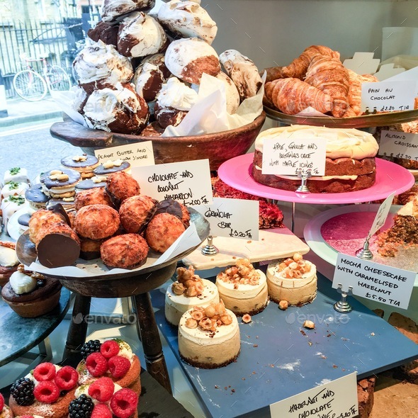 Cakes, pastry and other desserts stand in a local patisserie  - Stock Photo - Images