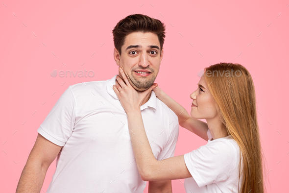 Angry woman chocking boyfriend during argument