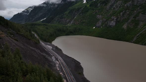 British Columbia Highway cutting through mountains and valleys next to Strohn Lake in Bear Glacier P alt