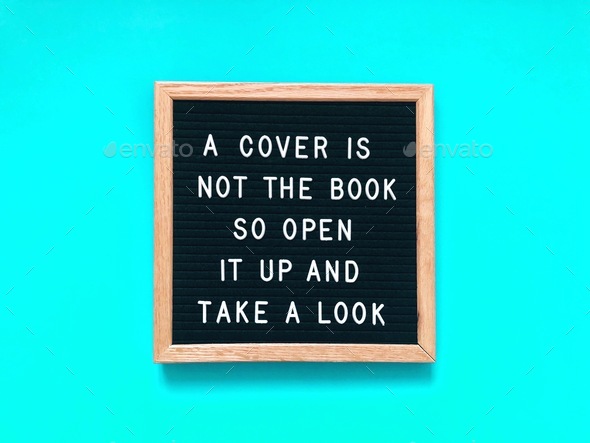 A cover is not the book, so open it up and take a look - Stock Photo - Images