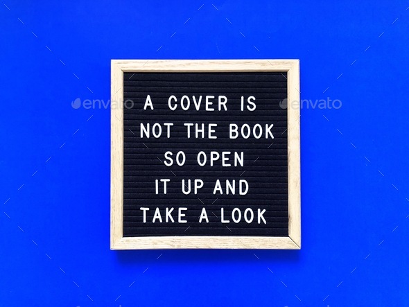 A cover is not the book, so open it up and take a look - Stock Photo - Images
