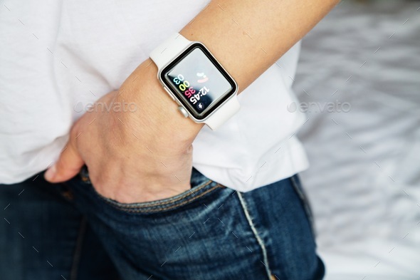 Female hand with modern smart Apple Watch  - Stock Photo - Images