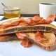 Freshly made french toast with crispy bacon, sweet honey drizzled over the toast and a cup of black  - PhotoDune Item for Sale