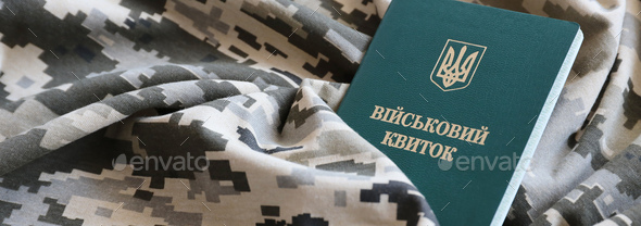 Ukrainian military ID on fabric with texture of pixeled camouflage - Stock Photo - Images