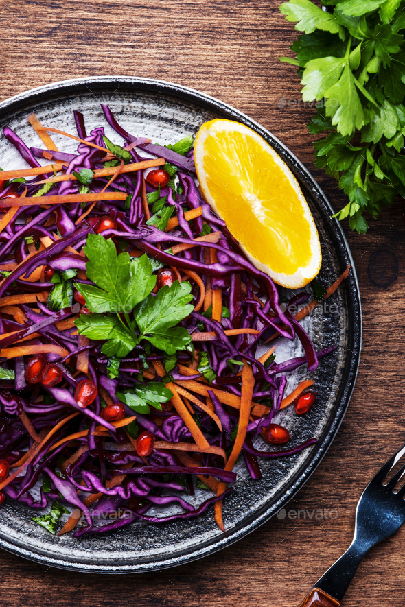 Coleslaw salad with red cabbage, carrot, parsley, pomegranate seeds and