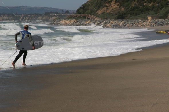 Surfer at the California beach - Stock Photo - Images