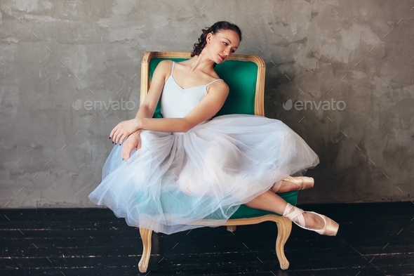 Ballet dancer ballerina in beautiful light blue dress tutu skirt posing ...