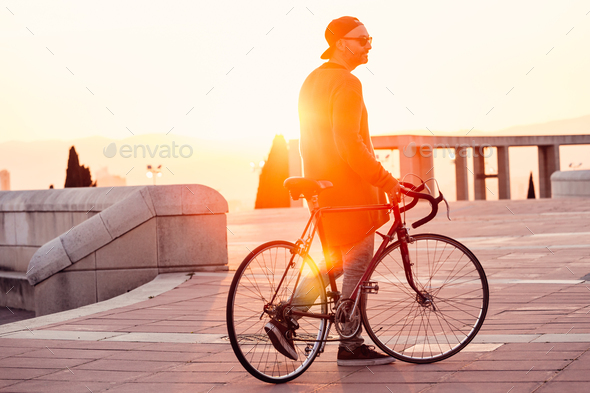 Man walking down the stairs with a bike