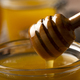 Honey on wooden honey-dipper closeup food background - PhotoDune Item for Sale