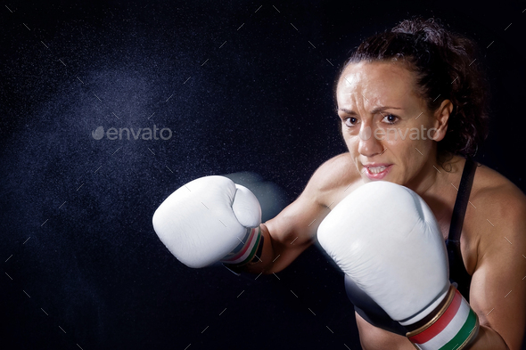 Female fighter with boxing gloves
