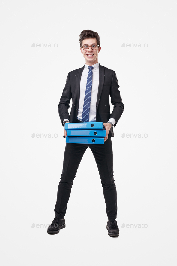 Funny intelligent man in office outfit with stack of paper folders